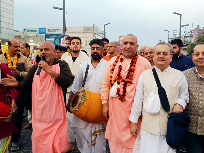 Devotees taking out Nagar Sankirtan Shobha Yatra at Gandhi Nagar Jammu on Saturday.