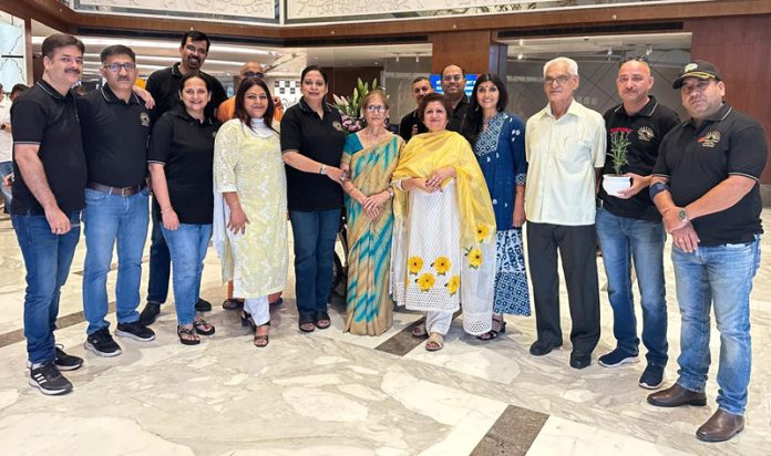 Rashmi Sharma Rai posing along with others during a function held in Jammu on Wednesday.