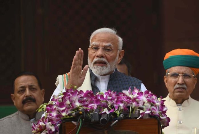 Prime Minister Narendra Modi talking to newsmen on arrival at Parliament House in New Delhi on Monday. (UNI)