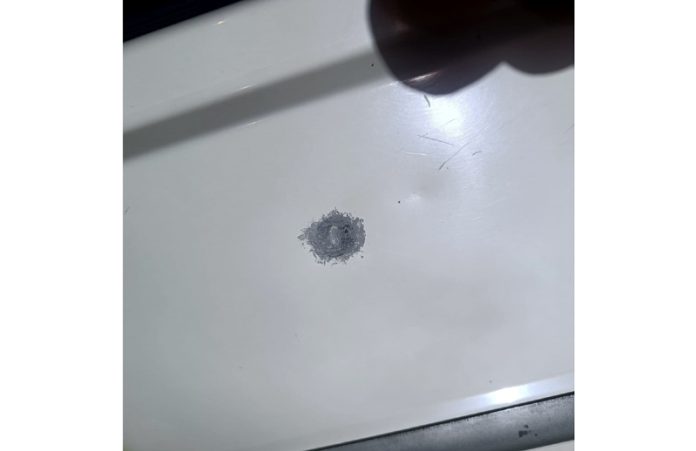 A bullet mark on the car.