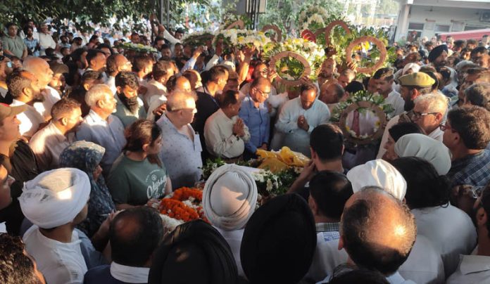 People paying their last tribute to Devender Singh Rana before cremation at Shastri Nagar Cremation Ground on Friday.