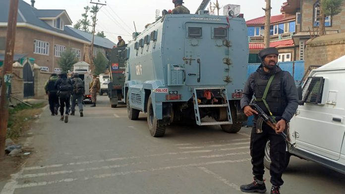 Security forces near the site of encounter at Kulgam.