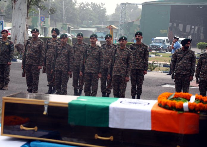 Army jawans pay last respects to Naib Subedar Rakesh Kumar at Air Force Station in Jammu on Monday.