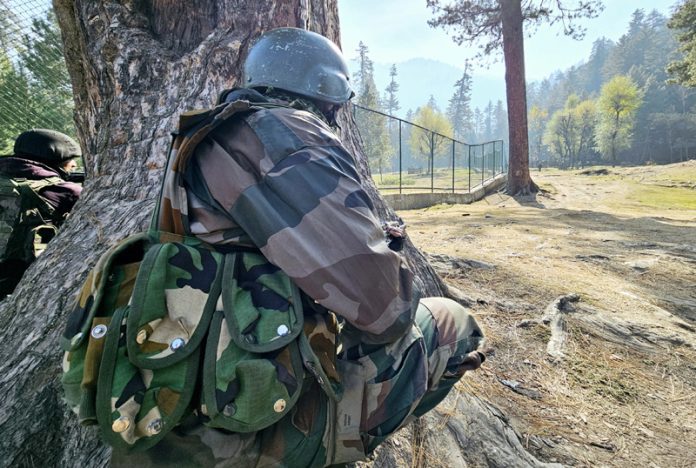 Security personnel during encounter in Devar area of Lolab in Kupwara district on Wednesday. -Excelsior/Aabid Nabi