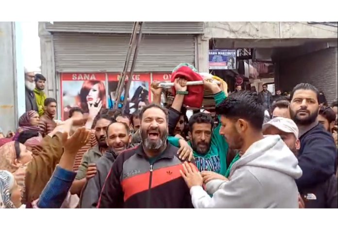 People wail and protest after the woman succumbed to injuries sustained in a grenade attack in Srinagar.