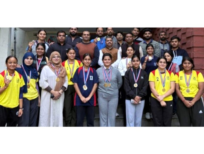 Winners of Inter Collegiate Power and Weight Lifting Championships pose for a photograph in Jammu.