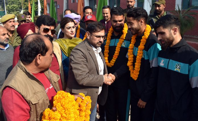 Minister of YS & S, Satish Sharma interacting with football players at Jammu. -Excelsior/Rakesh