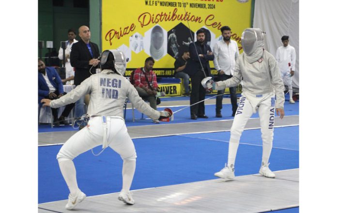 Fencers displaying their skills during a match at Jammu University. - Excelsior/Rakesh