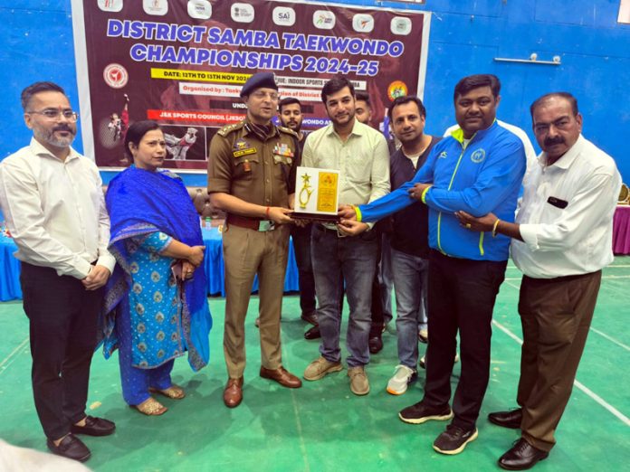 Dignitaries receiving memento during District Samba Taekwondo Championship.