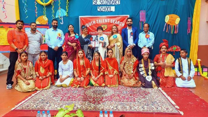 Students posing along with dignitaries during a programme in JK Montessorie School.