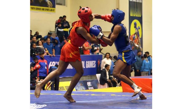 Players in action during a Wushu bout at Indoor Sports Complex, Bhagwati Nagar, Jammu on Saturday. -Excelsior/Rakesh