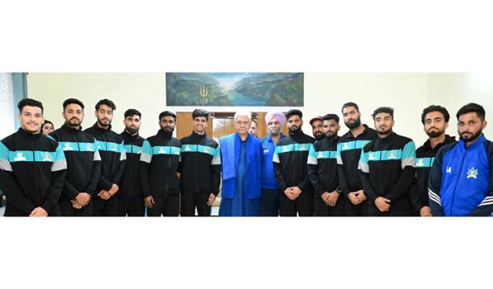 LG Manoj Sinha posing along with J&K Senior Men's Football team at Raj Bhawan.