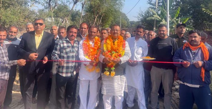 MLA, Vijaypur, Chander Parkash Ganga kick starting blacktopping of link road from Rahya to Ranjari on Thursday.