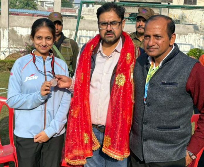 Sports Minister Satish Sharma posing along with fencer Chhavi Sharma at Jammu.