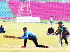 A player in action at 35th Senior National Tennis Ball Cricket championship in MA Stadium Jammu. -Excelsior/Rakesh