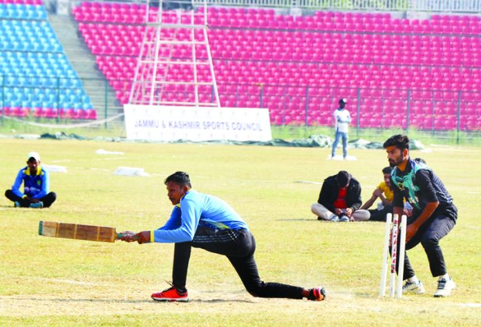 A player in action at 35th Senior National Tennis Ball Cricket championship in MA Stadium Jammu. -Excelsior/Rakesh