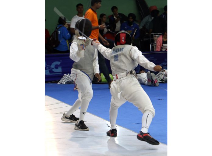 Fencers in action during second day of All India Inter-University Fencing Championship at Jammu University. —Excelsior/Rakesh