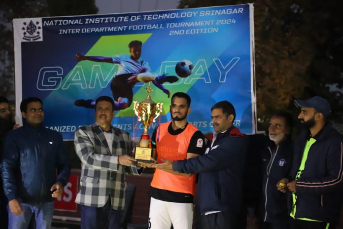 ECE Department captain receiving trophy at NIT Srinagar.