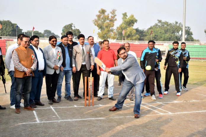 Sports Minister Satish Sharma testing his batting skills during inaugural event at Jammu.