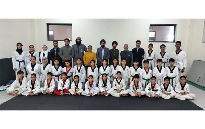 Selected Sub Junior Taekwondo team posing along with dignitaries.