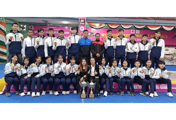 Winners in ongoing 68th National School Games pose for a group photograph with others at Jammu on Thursday.