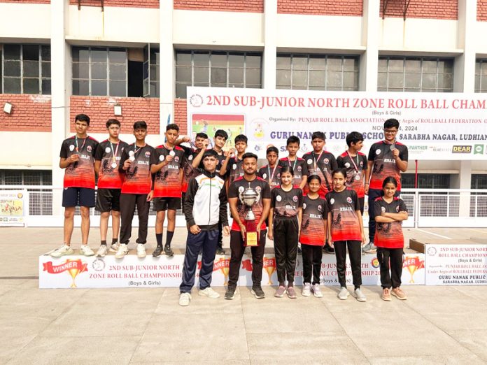 J&K Rollball team posing along with medals & trophy.