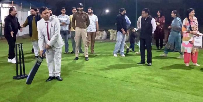 MLA Kathua Dr Bharat Bhushan testing his batting skills during the inaugural event of cricket facility at Kathua.