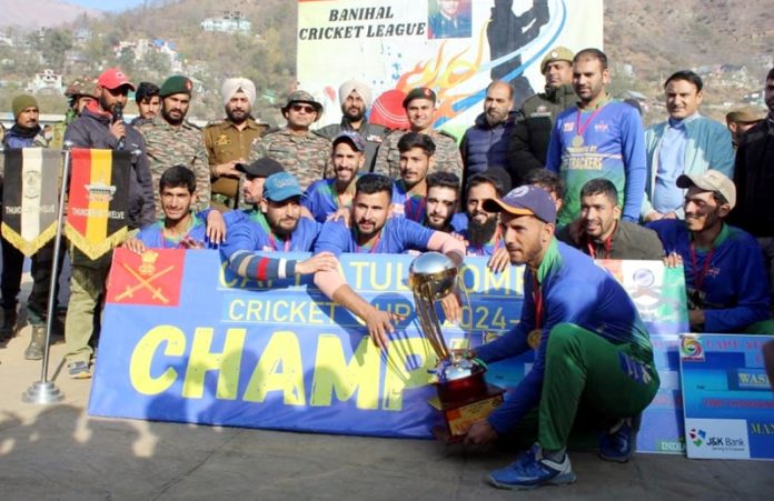 Winning team posing along with trophy and dignitaries at Ramban on Monday.