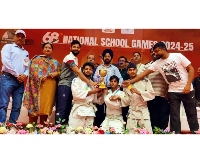 Dignitaries presenting trophy to winning team during prize distribution ceremony at Jammu. —Excelsior/Rakesh