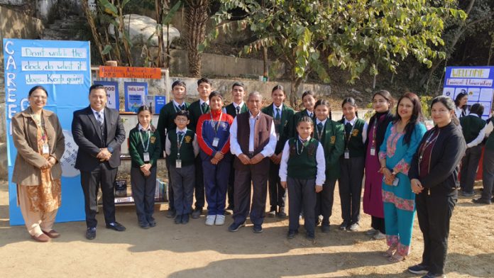 Students posing along with management of DPS Udhampur.