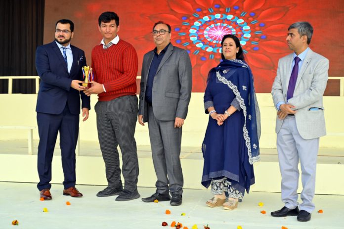 G D Goenka Public School student receiving award during Annual Day event.