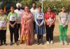 Athletes of DIS posing with their Coach and Principal after clinching winners’ trophy in Sahodaya Athletics Championship.