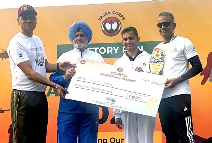 Runners from Jammu receive prize after excelling in first edition of Amritsar Half Marathon.