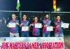 Players of Roller Skating Club Jindrah team pose for a photograph after lifting J&K Master Games title.