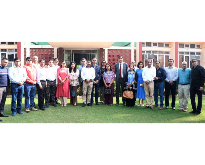 Ex-students of BSF School, Paloura pose for a group photograph with teachers during a reunion function in Jammu.