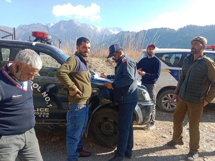 Traffic and local police during special checking on Mughal Road in Poonch. - Excelsior/Waseem