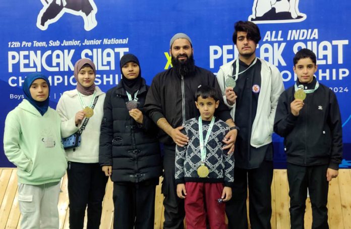 District Doda athletes who won medals in National Pencak Silat Championships 2024 pose for a group photograph.