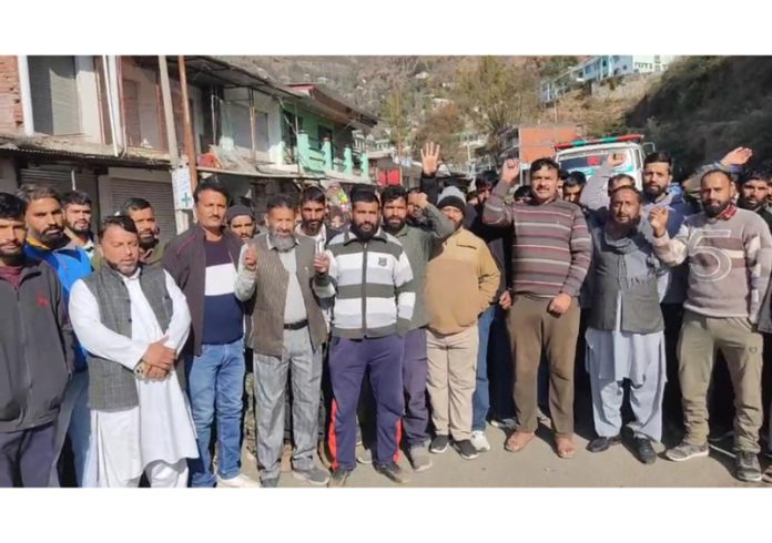 Local people staging protest at Shahdara Sharief in Rajouri on Monday. -Excelsior/Imran