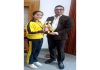 Akshini Manhas poses with trophies she won in 51st J&K UT Badminton championship.