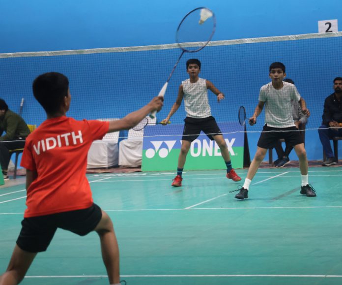 Badminton players in action during a match at MA Stadium Jammu on Friday. -Excelsior/Rakesh