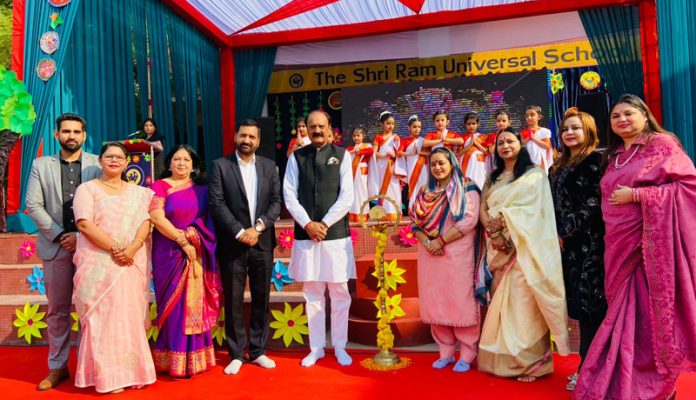 Dignitaries lighting ceremonial lamp to inaugurate the Annual Day celebrations of Elementary Wing of Shri Ram Universal School.