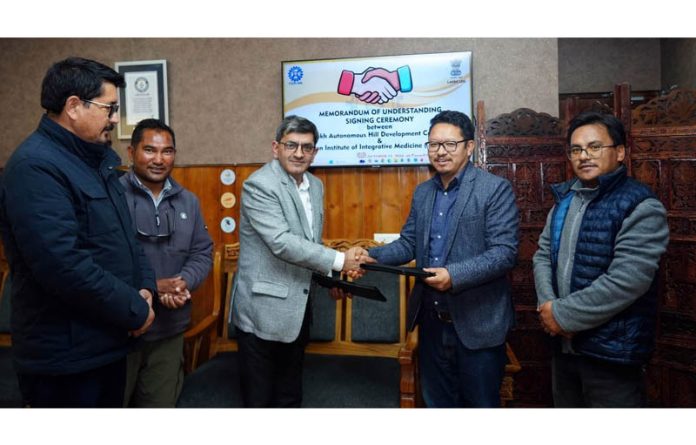 Dr. Zabeer Ahmed, Director CSIR-IIIM and Stanzin Chosphel, EC (Agriculture) at signing of MoU in Leh on Tuesday.