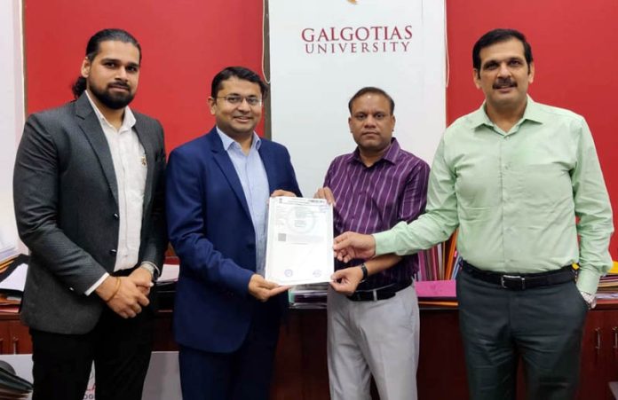 Dr Nitin Kumar Gaur, Registrar of GU and Anant Bengani, Co-Founder of Zell Education signing a MoU on Tuesday.