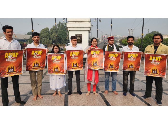 ABVP Jammu Kashmir leaders launching poster of Parishad's National Conference near Maharaja Hari Singh Statue in Jammu. -Excelsior/Rakesh