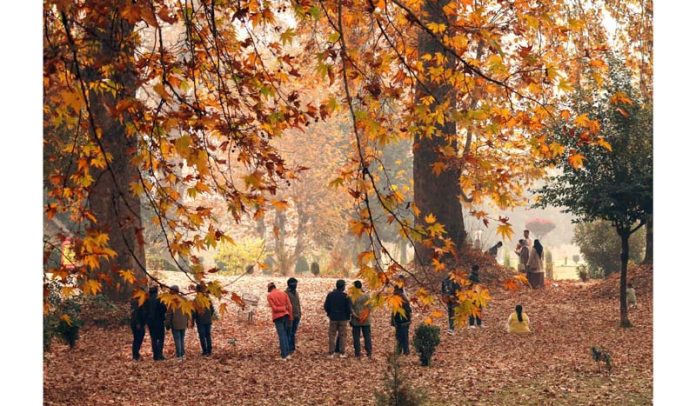 People enjoying at the Mughal garden in Srinagar. -Excelsior/Shakeel