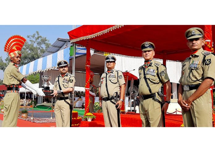 Puneet Rastogi, ADG BSF presenting trophy to a recruit constable in Udhampur on Saturday.