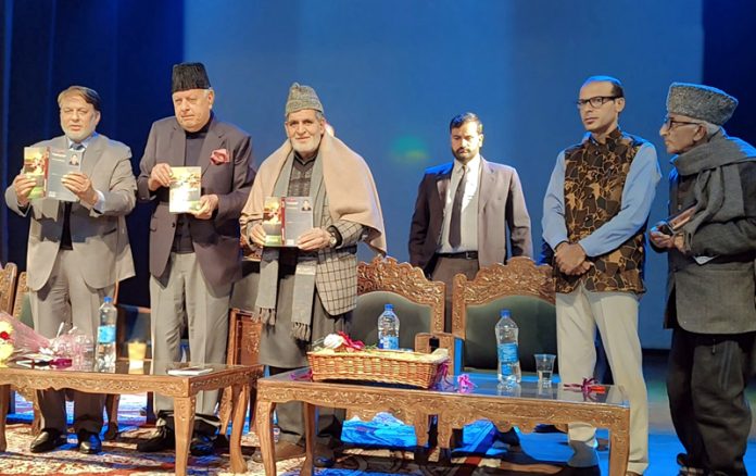 Dr Farooq Abdullah releasing books written by Dr Gazanfar and Enaya Ali in Srinagar on Saturday.