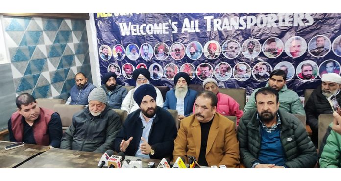 AJKTWA chairman Karan Singh Wazir flanked by Association members from Kashmir and Jammu at a press conference in Srinagar.