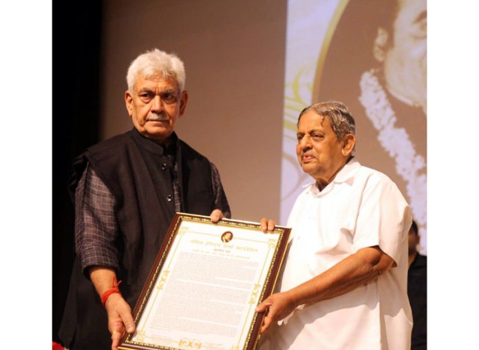 Lt Governor Manoj Sinha presents Pandit Haridutt Sharma Award to Dr. H R Nagendra.