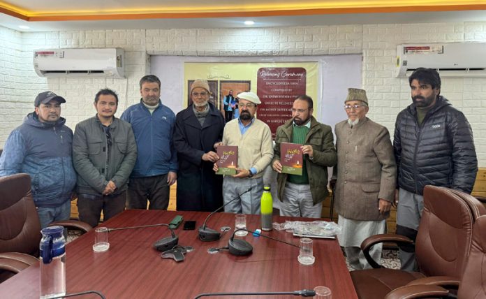 CEC Kargil Dr Mohd Jaffer Akhoon releasing a book during a function held in Kargil on Sunday.